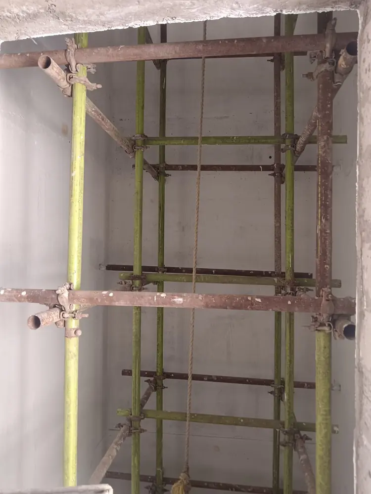 Cuplock scaffold standards, ledgers and working platform at a project site