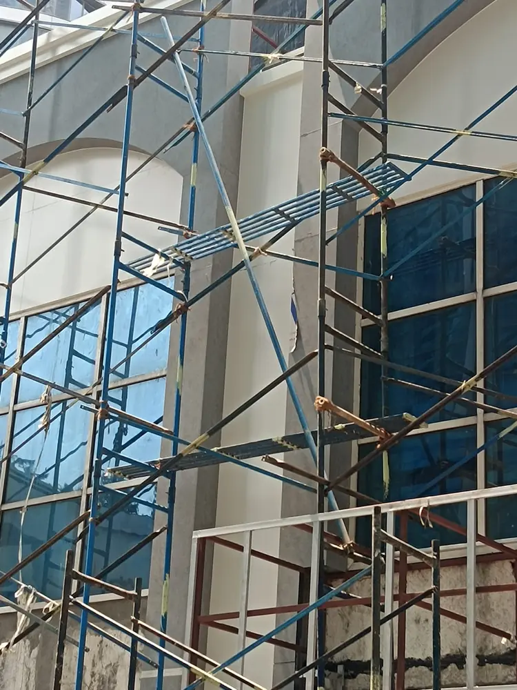 Tall building façade requiring planned elevated access