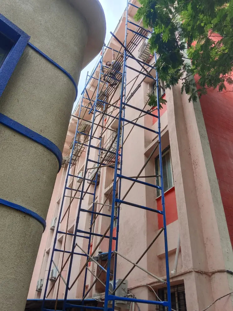 Narrow building access area where scaffold support needs careful planning