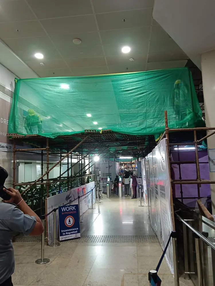 Covered scaffolding protecting an active work area